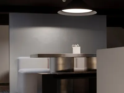 Cozy living space with a modern dining table, two couches, and dim lighting