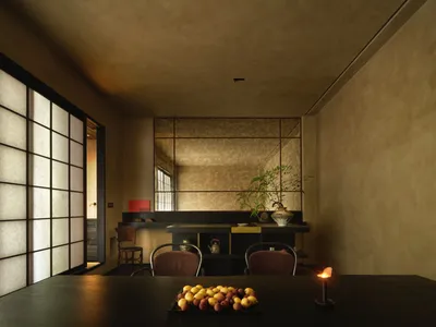 溫馨餐廳空間，擁有混凝土牆、餐桌、椅子、水果與杯具