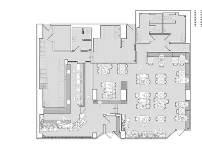 Empty black and white floor plan of a minimalist restaurant with multiple dining tables and chairs arranged throughout the space