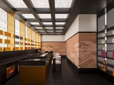 Elegant showroom with black and gold accents, chairs, and dining tables, creating a sophisticated atmosphere
