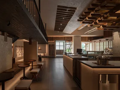 Inviting restaurant interior with a bar area, wine glasses, and comfortable seating