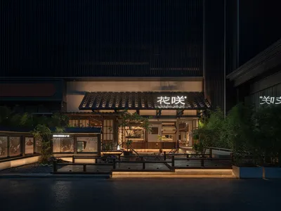 Modern Asian restaurant exterior with a prominent roof, potted plants, and a car parked outside