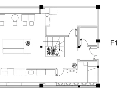 Empty white living room with a couch, two chairs, and a potted plant, creating a clean and minimalistic atmosphere