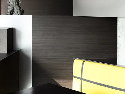 Warm and inviting interior design with wood floors and walls, featuring a dining table and two chairs
