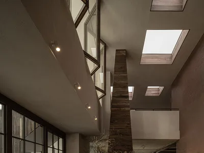 Cozy modern dining space with wooden feature, multiple tables, chairs, and dim lighting