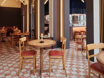 cozy restaurant interior with wooden floors, tables, chairs, and wine glasses