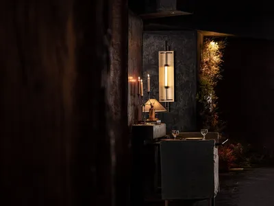 A cozy dining area with a table set for dinner, chairs, and a warm atmosphere