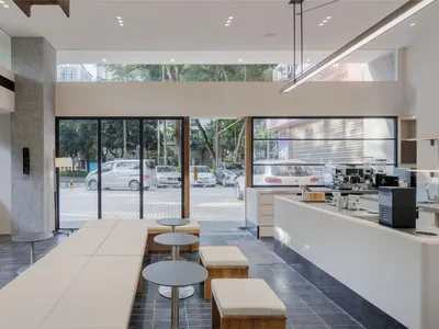 Inviting open space with seating options, a dining table, and ample room for guests to relax and socialize