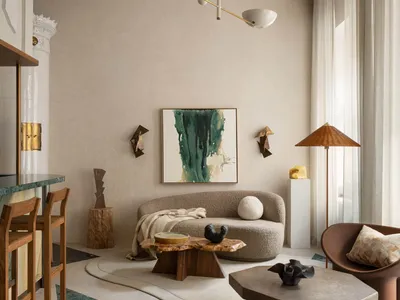 Cozy living area with a couch, chairs, tables, lamps, and decorative items, featuring a combination of wood and metal elements