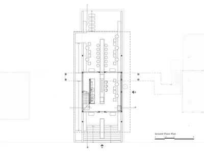 Ground floor plan of a modern restaurant with various rooms and spaces, stairs, seating arrangements, and functional elements, featuring neutral tones and clean lines
