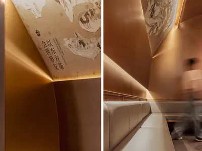 溫馨餐廳內部，木製長椅、現代設計與舒適氛圍