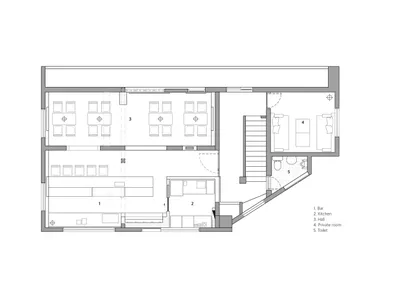 2D floor plan of a hotel with modern and traditional design elements, white walls, and natural light from windows