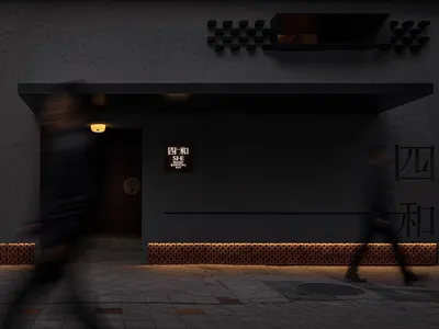Gray modern building with a man walking towards the camera, another person walking away, and a third person in the background