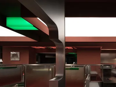 Modern restaurant interior with red walls, silver accents, and multiple dining tables and chairs