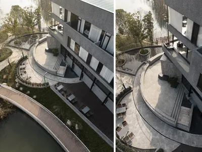 Modern hotel or resort with a circular patio area surrounded by chairs and dining tables, featuring a combination of concrete and glass elements