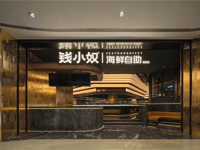 Modern Asian restaurant with a black marble countertop, natural light, and a TV mounted on the wall