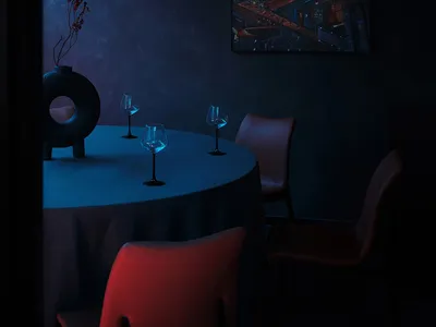 A dark and intimate dining area with a round table, chairs, and wine glasses, set for dinner service