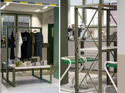 A store display featuring mannequins in various clothing styles, with a green theme and cups placed around the store