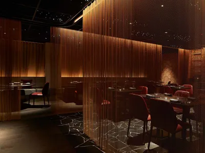 A modern restaurant with several tables and chairs, creating an inviting and comfortable atmosphere with a focus on functionality and contemporary aesthetics