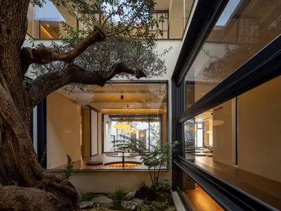 A bright and inviting indoor space with multiple chairs, a large window, and natural light