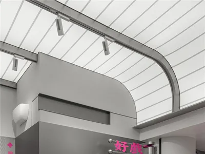 Modern restaurant interior with pink benches, dining tables, and comfortable seating for guests