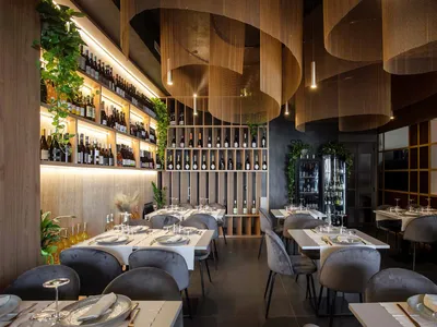 Modern restaurant interior with dining tables, chairs, and wine bottles, featuring a sophisticated ambiance