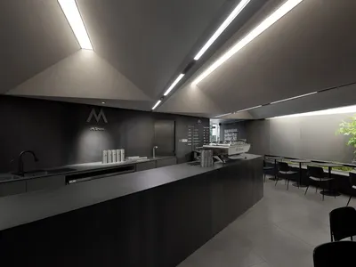 乾淨整潔的餐廳櫃檯，展示水槽、瓶子、杯子和碗，並配有顧客座椅