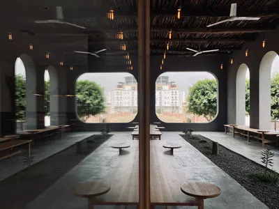 設計精良的室內餐廳區域，配有木桌木椅、大片窗戶帶來自然光線，營造溫馨氛圍
