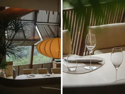 木質與金屬元素的餐廳區域，光線充足且溫馨誘人，搭配椅子、餐桌與酒杯