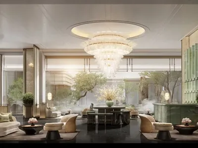 Sophisticated dining space with a large chandelier, multiple chairs, and decorative vases