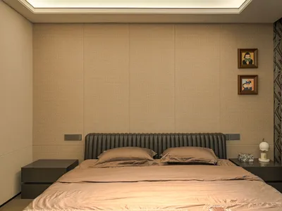 Cozy bedroom with a large wooden bed, brown sheets, and two framed pictures on the wall