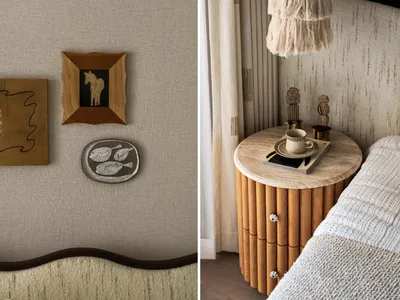 A well-lit bedroom with wall decor, a wooden dresser, and a fish plate, creating a comfortable atmosphere