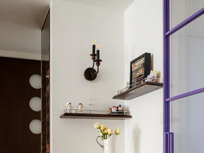 Cozy living space with a fireplace mantel, vases, and figurines, creating a warm and inviting atmosphere