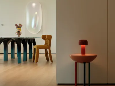 A modern dining space with a glass table, surrounded by chairs and decorated with vases, creating a cozy and inviting atmosphere