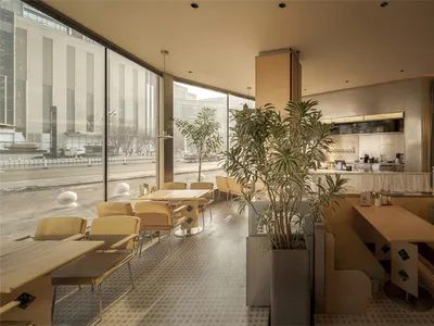 A modern restaurant with a large dining area filled with natural light, wooden elements, and potted plants, creating a warm and inviting atmosphere