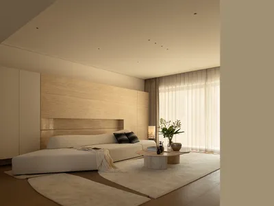 Cozy bedroom with a wooden floor, a bed, a table, and a vase, decorated in a white color scheme