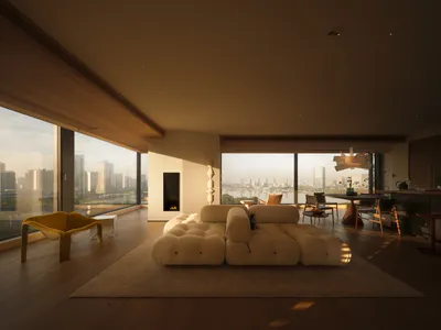 A modern living room with a large white couch, a fireplace, and a dining table, surrounded by various chairs and a potted plant, with natural light streaming in through the windows