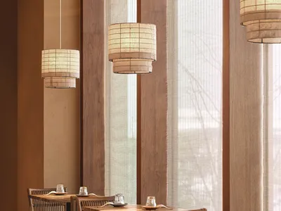 Cozy restaurant with wooden furniture, natural light, and a warm atmosphere