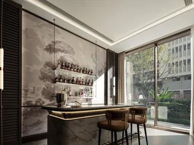 A modern bar with a marble counter, brown chairs, and a large collection of bottles, surrounded by a potted plant in a well-lit setting