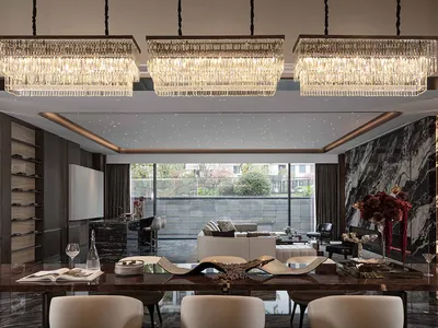 Luxurious living room with a dining area, kitchen, and comfortable seating, featuring wood and glass materials and natural light