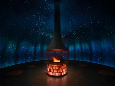Cozy room with a stone wall and a burning fireplace, creating a warm atmosphere