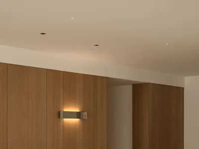 Bathroom with a wooden sink and walls, dim lighting creating a cozy atmosphere