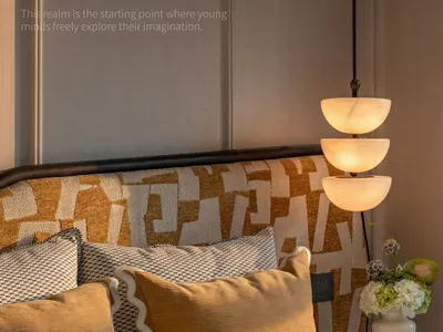 A cozy bedroom with a bed, a lamp, and a vase, featuring a yellow and white color scheme and soft warm lighting