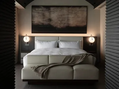 Cozy bedroom with a white bed, brown blanket, and black and white color scheme, featuring a large window for natural light