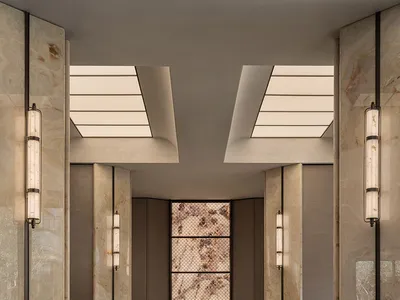 Elegant hotel lobby with marble flooring, well-lit and sophisticated design