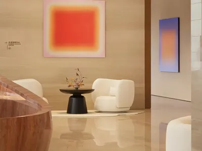 A well-lit living room with a modern design, featuring a large window, a couch, chair, dining table, and vases, in a clean and minimalistic style