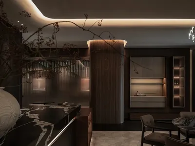 A well-lit modern kitchen with wooden cabinets, a dining table, and chairs, surrounded by natural materials and clean design elements