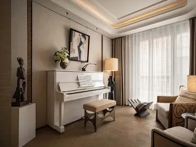 Cozy living room with a grand piano, couch, chair, and bench, featuring a mix of natural and artificial lighting and various decorative elements