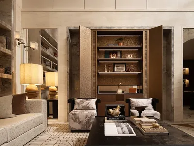 A well-lit living room with a couch, chair, bookshelf, and lamps, creating a cozy and inviting atmosphere for relaxation and leisure