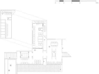 Large modern restaurant space with dining area, chairs, and tables, with dim lighting and predominantly white materials